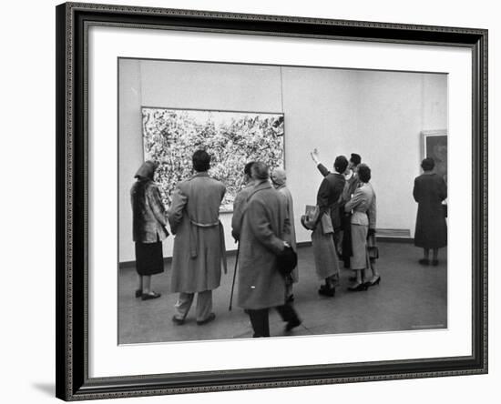 People Looking at a Painting by Artist Jackson Pollack at an American Art Show-Frank Scherschel-Framed Photographic Print
