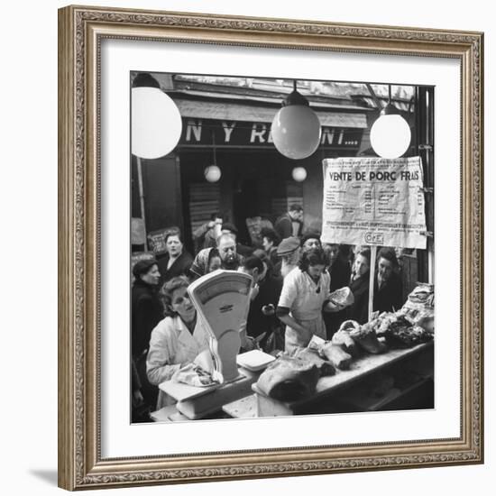 People Looking at Meat in Meat Store While Butchers Measure Out Meats-Yale Joel-Framed Photographic Print