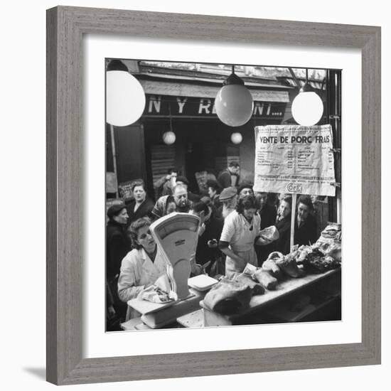 People Looking at Meat in Meat Store While Butchers Measure Out Meats-Yale Joel-Framed Photographic Print