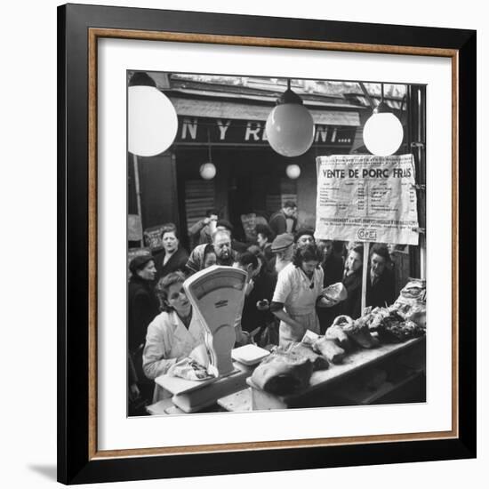 People Looking at Meat in Meat Store While Butchers Measure Out Meats-Yale Joel-Framed Photographic Print