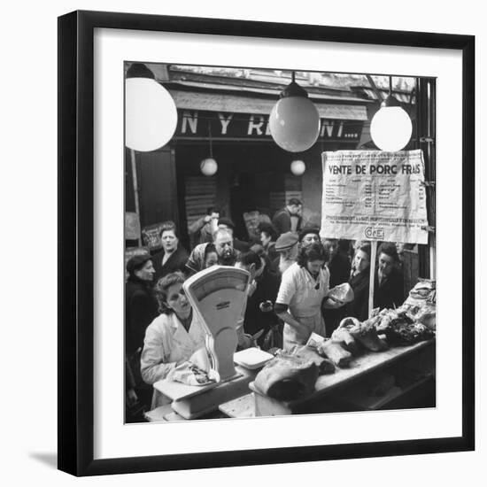 People Looking at Meat in Meat Store While Butchers Measure Out Meats-Yale Joel-Framed Photographic Print