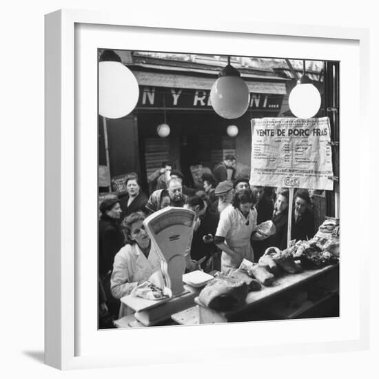 People Looking at Meat in Meat Store While Butchers Measure Out Meats-Yale Joel-Framed Photographic Print