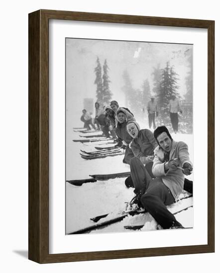 People Playing Tug of War During Snowstorm at Timberline Lodge Ski Club Party-Ralph Morse-Framed Photographic Print