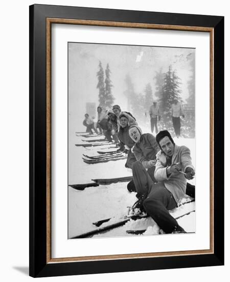 People Playing Tug of War During Snowstorm at Timberline Lodge Ski Club Party-Ralph Morse-Framed Photographic Print