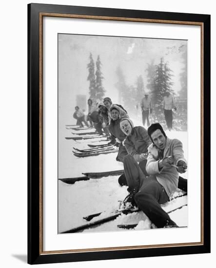 People Playing Tug of War During Snowstorm at Timberline Lodge Ski Club Party-Ralph Morse-Framed Photographic Print