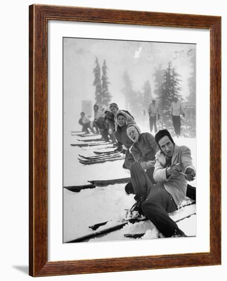 People Playing Tug of War During Snowstorm at Timberline Lodge Ski Club Party-Ralph Morse-Framed Photographic Print