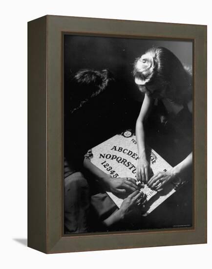 People Playing with a Ouija Board-Wallace Kirkland-Framed Premier Image Canvas