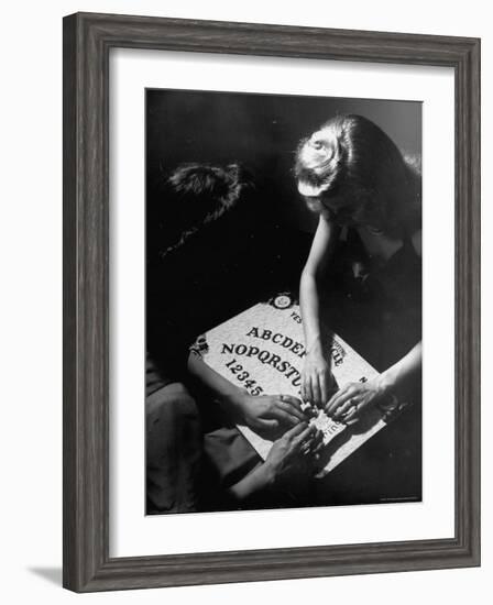 People Playing with a Ouija Board-Wallace Kirkland-Framed Photographic Print