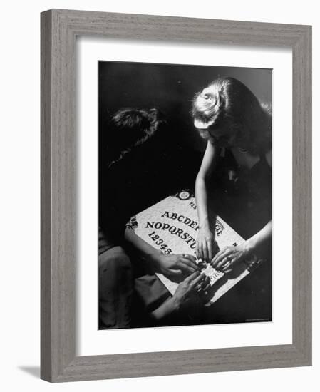 People Playing with a Ouija Board-Wallace Kirkland-Framed Photographic Print