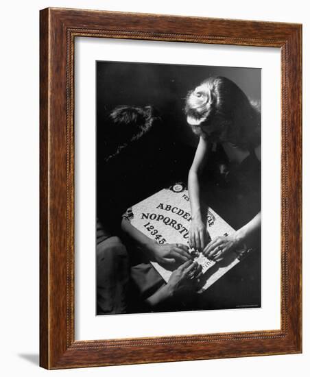 People Playing with a Ouija Board-Wallace Kirkland-Framed Photographic Print