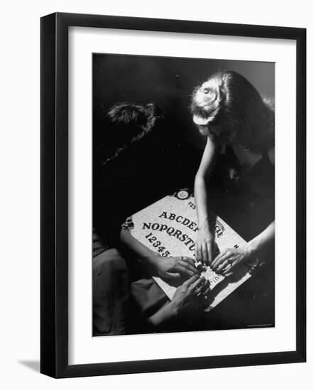 People Playing with a Ouija Board-Wallace Kirkland-Framed Photographic Print