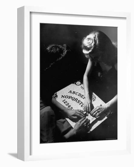 People Playing with a Ouija Board-Wallace Kirkland-Framed Photographic Print