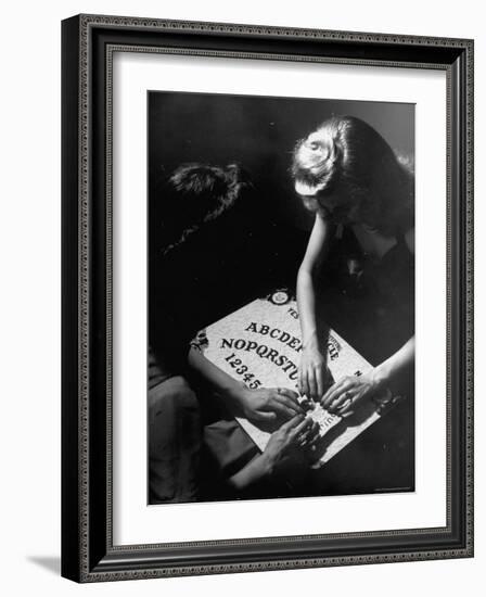 People Playing with a Ouija Board-Wallace Kirkland-Framed Photographic Print