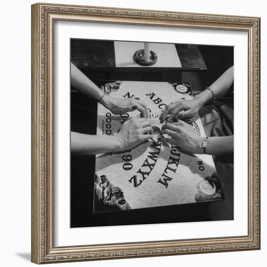 People Playing with a Ouija Board-null-Framed Photographic Print