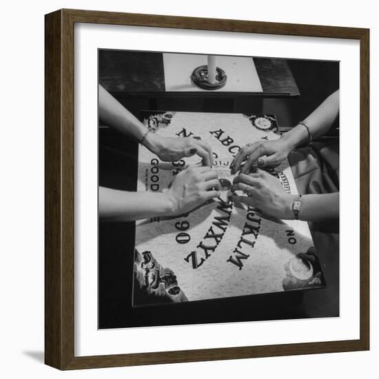 People Playing with a Ouija Board-null-Framed Photographic Print