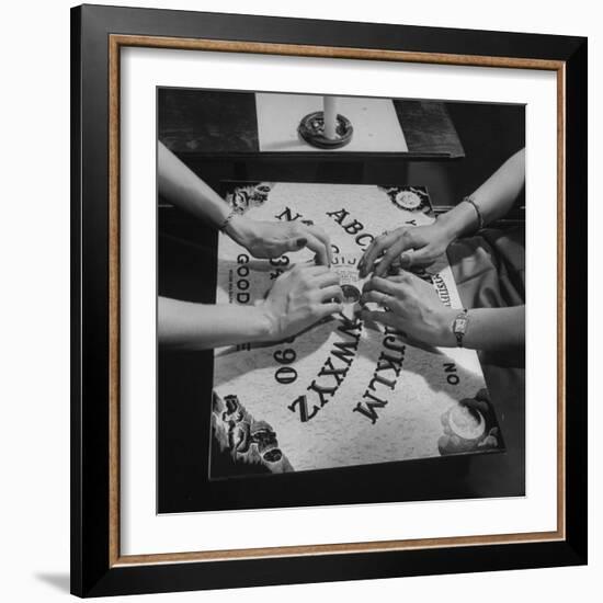 People Playing with a Ouija Board-null-Framed Photographic Print