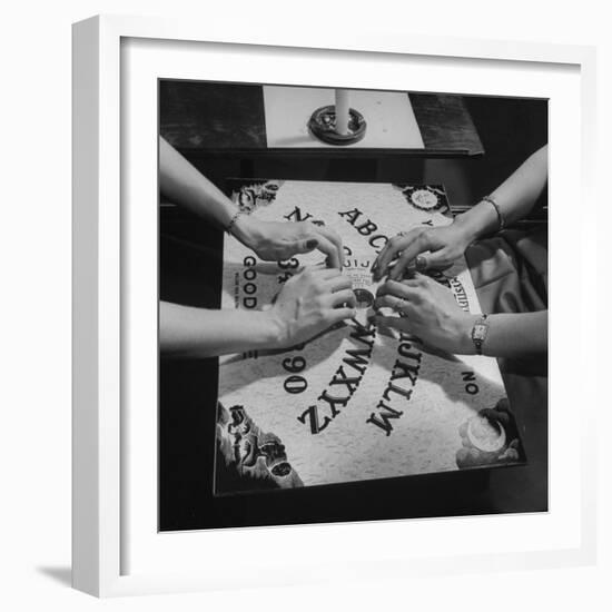 People Playing with a Ouija Board-null-Framed Photographic Print