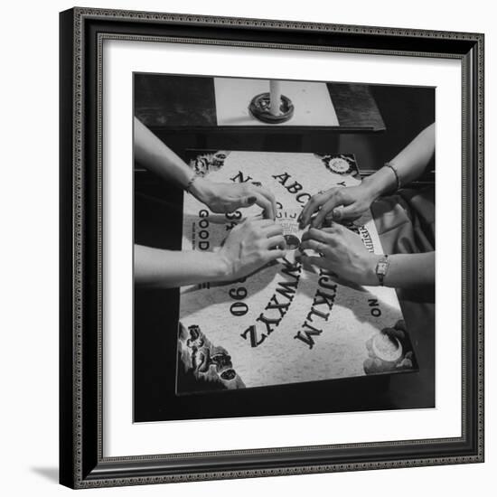 People Playing with a Ouija Board-null-Framed Photographic Print