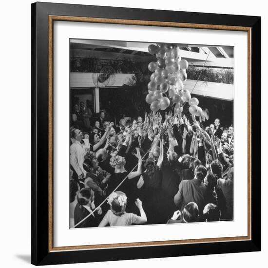 People Reaching For the Balloons at the Palm Beach Party-Herbert Gehr-Framed Photographic Print