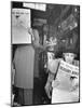 People Reading Tribune Newspaper on Train-William C^ Shrout-Mounted Photographic Print