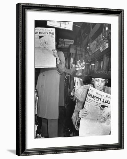 People Reading Tribune Newspaper on Train-William C^ Shrout-Framed Photographic Print