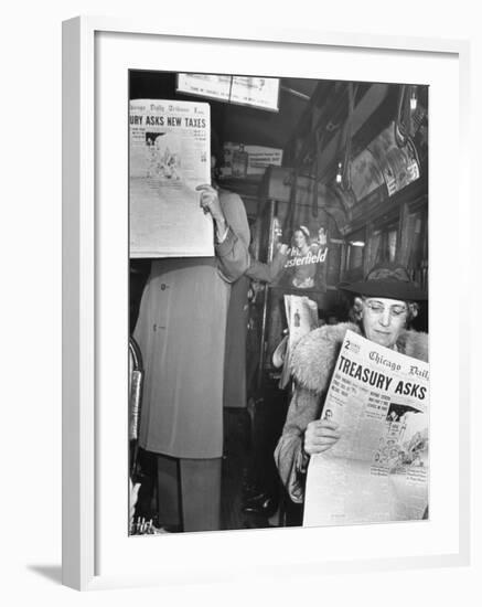 People Reading Tribune Newspaper on Train-William C^ Shrout-Framed Photographic Print