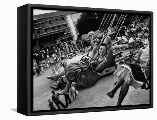 People Riding a Merry Go Round, During the Celebration of Munich's 800th Anniversary-Michael Rougier-Framed Premier Image Canvas