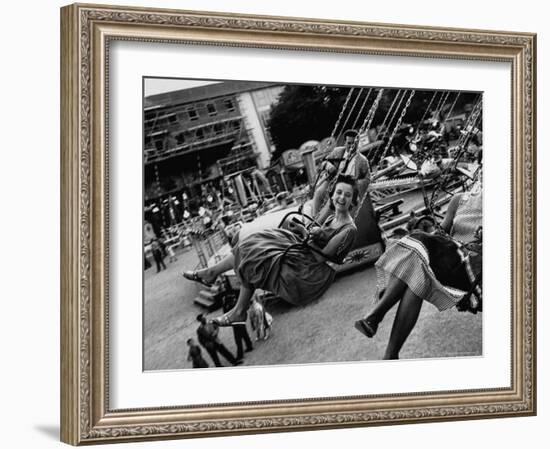 People Riding a Merry Go Round, During the Celebration of Munich's 800th Anniversary-Michael Rougier-Framed Photographic Print