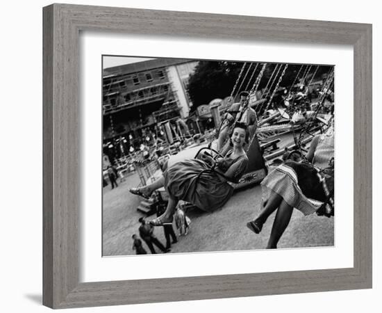 People Riding a Merry Go Round, During the Celebration of Munich's 800th Anniversary-Michael Rougier-Framed Photographic Print