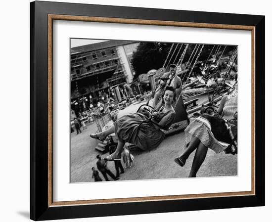 People Riding a Merry Go Round, During the Celebration of Munich's 800th Anniversary-Michael Rougier-Framed Photographic Print