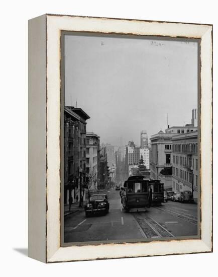 People Riding on Dual Cable Cars, with Bay Bridge Sitting in Background-Charles E^ Steinheimer-Framed Premier Image Canvas