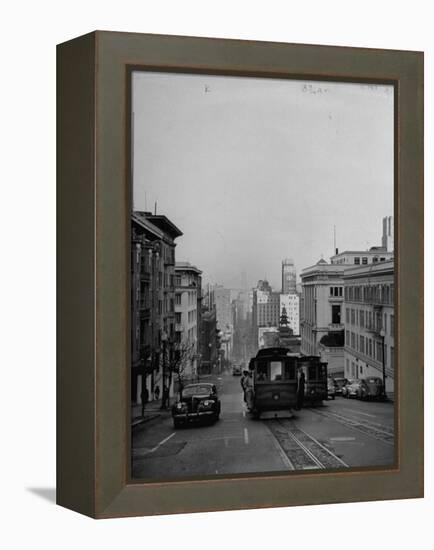 People Riding on Dual Cable Cars, with Bay Bridge Sitting in Background-Charles E^ Steinheimer-Framed Premier Image Canvas