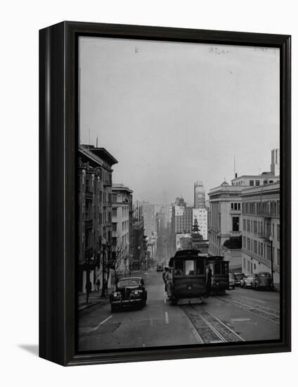 People Riding on Dual Cable Cars, with Bay Bridge Sitting in Background-Charles E^ Steinheimer-Framed Premier Image Canvas