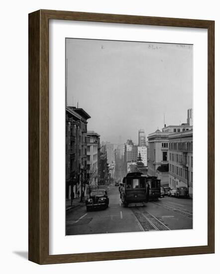 People Riding on Dual Cable Cars, with Bay Bridge Sitting in Background-Charles E^ Steinheimer-Framed Photographic Print