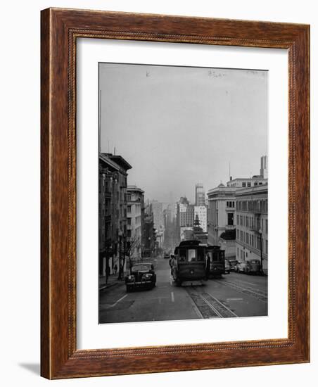 People Riding on Dual Cable Cars, with Bay Bridge Sitting in Background-Charles E^ Steinheimer-Framed Photographic Print