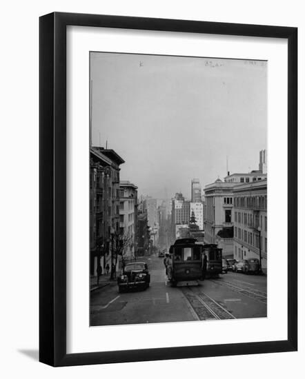 People Riding on Dual Cable Cars, with Bay Bridge Sitting in Background-Charles E^ Steinheimer-Framed Photographic Print