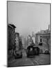 People Riding on Dual Cable Cars, with Bay Bridge Sitting in Background-Charles E^ Steinheimer-Mounted Photographic Print