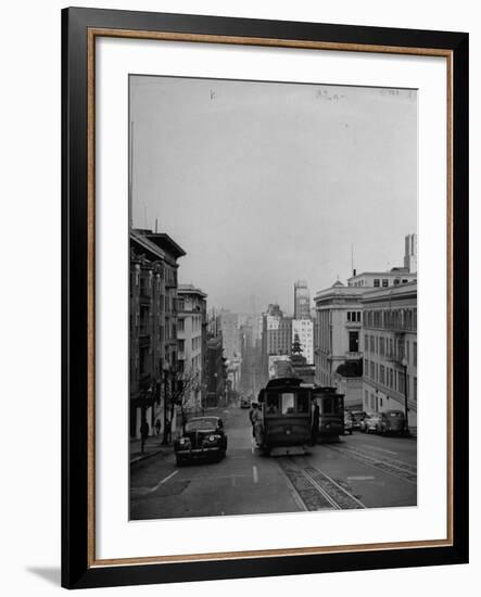 People Riding on Dual Cable Cars, with Bay Bridge Sitting in Background-Charles E^ Steinheimer-Framed Photographic Print