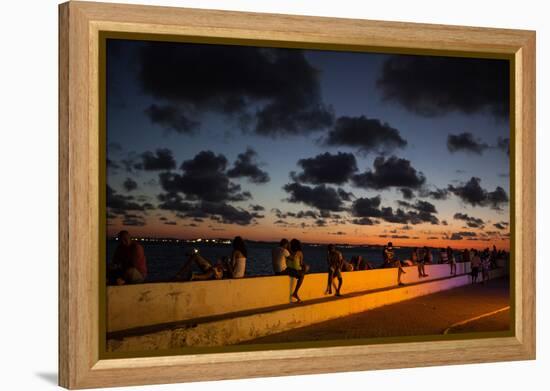 People Sitting on a Wall in Salvador at Dusk-Alex Saberi-Framed Premier Image Canvas