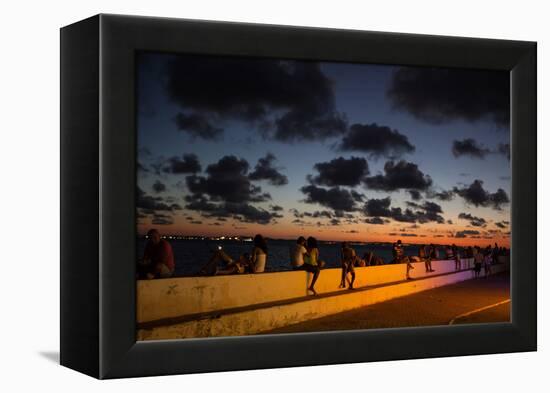 People Sitting on a Wall in Salvador at Dusk-Alex Saberi-Framed Premier Image Canvas