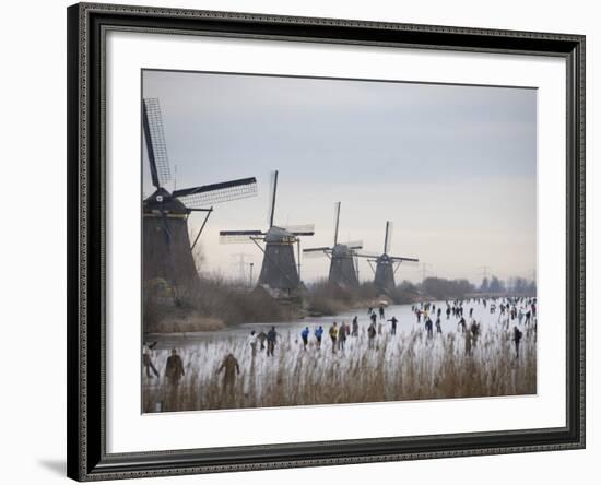 People Skate on Frozen Canals in Kinderdijk's Mill Area, a UNESCO World Heritage Site, Netherlands-null-Framed Photographic Print