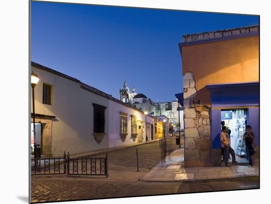 People Stood in Shop Doorway at Dusk, Oaxaca, Oaxaca State, Mexico-Peter Adams-Mounted Photographic Print