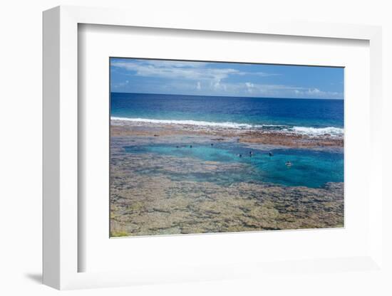 People swimming in the amazing Limu low tide pools, Niue, South Pacific, Pacific-Michael Runkel-Framed Photographic Print