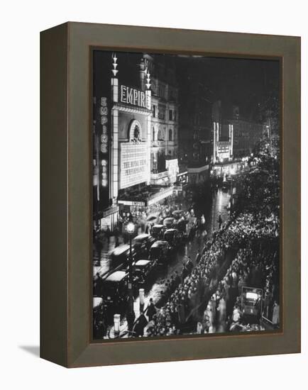 People Waiting in Front of the Brightly Lighted Empire Theatre for the Royal Film Performance-Cornell Capa-Framed Premier Image Canvas