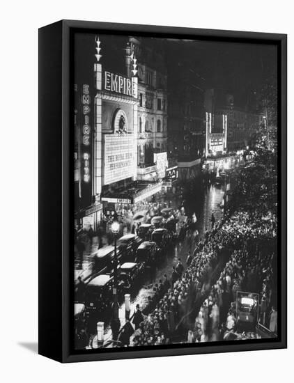 People Waiting in Front of the Brightly Lighted Empire Theatre for the Royal Film Performance-Cornell Capa-Framed Premier Image Canvas