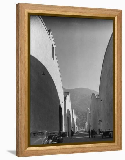 People Walking Between Sound Stages at Warner Bros. Studio-Margaret Bourke-White-Framed Premier Image Canvas