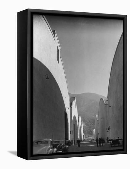 People Walking Between Sound Stages at Warner Bros. Studio-Margaret Bourke-White-Framed Premier Image Canvas