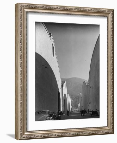 People Walking Between Sound Stages at Warner Bros. Studio-Margaret Bourke-White-Framed Photographic Print