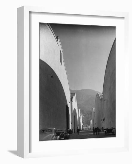 People Walking Between Sound Stages at Warner Bros. Studio-Margaret Bourke-White-Framed Photographic Print
