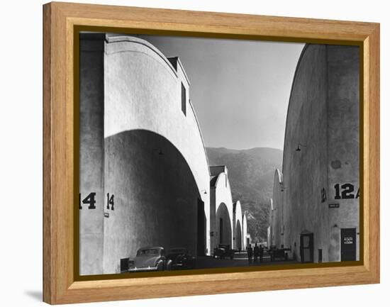 People Walking Between Sound Stages at Warner Brothers Studio-Margaret Bourke-White-Framed Premier Image Canvas